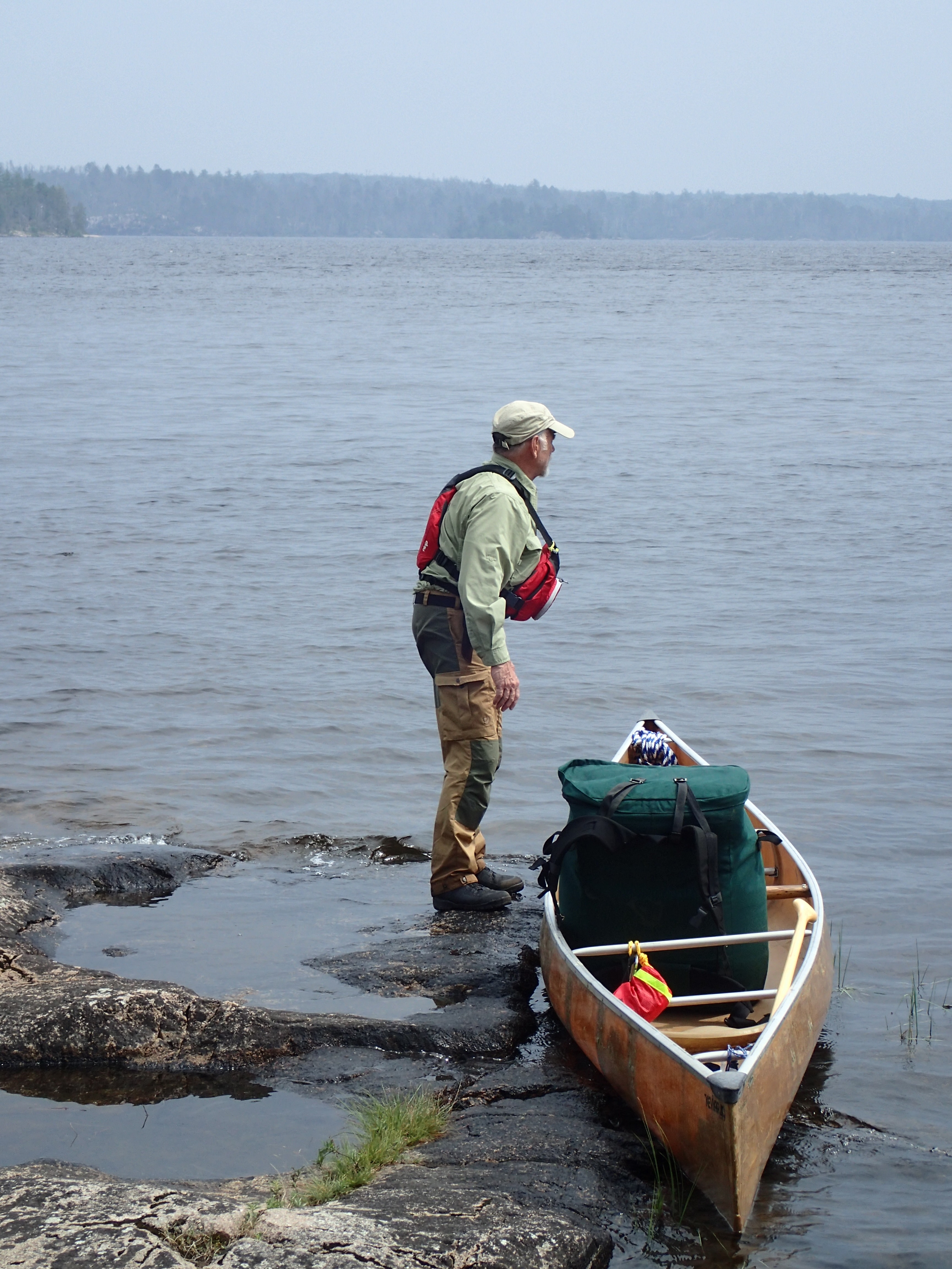 Royce with partly loaded canoe on Crooked Lake side of Curtain Falls 2025-08-06 13:19