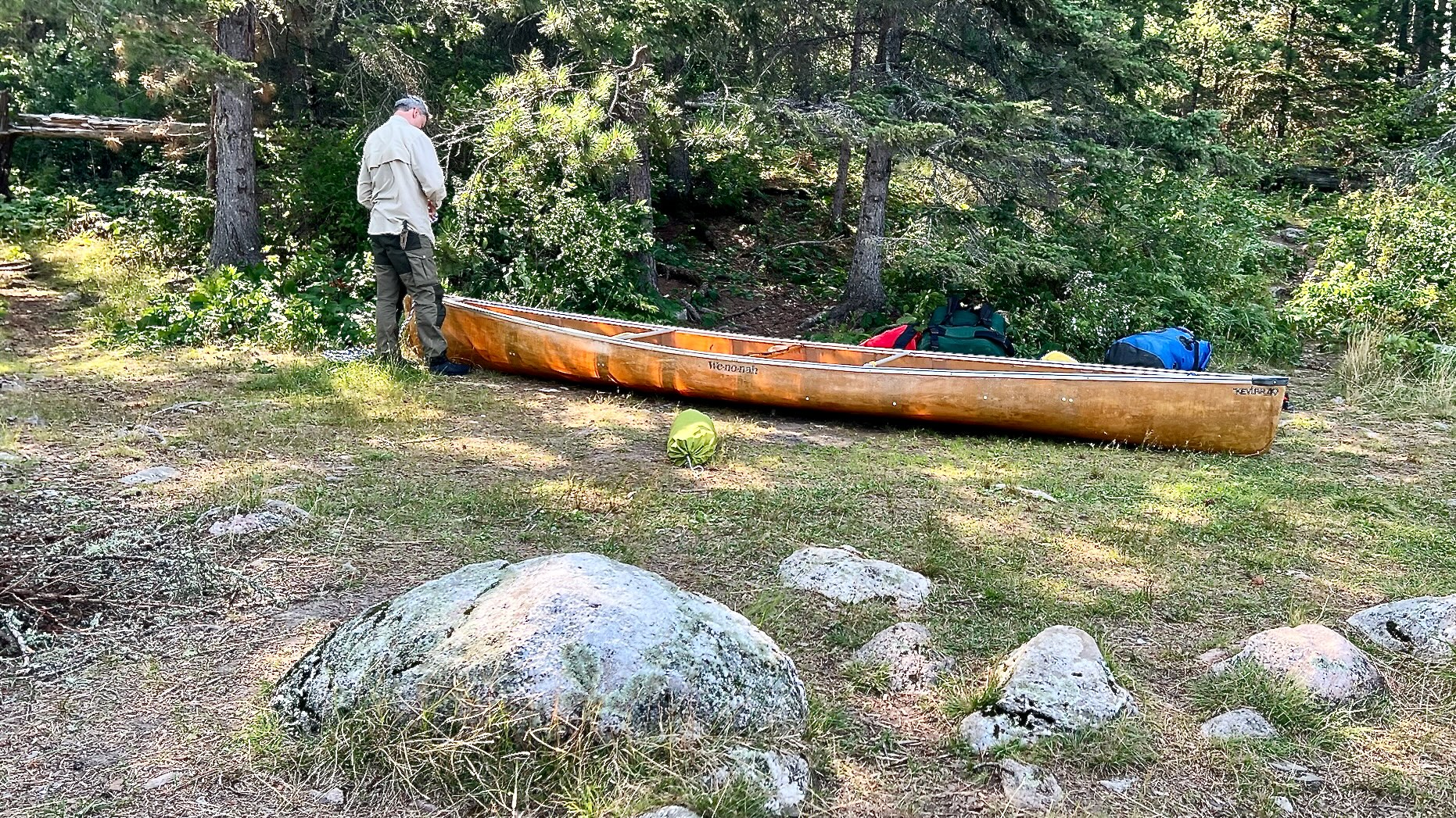 Ben tying down canoe on Crooked Lake 2025-08-06 16:11