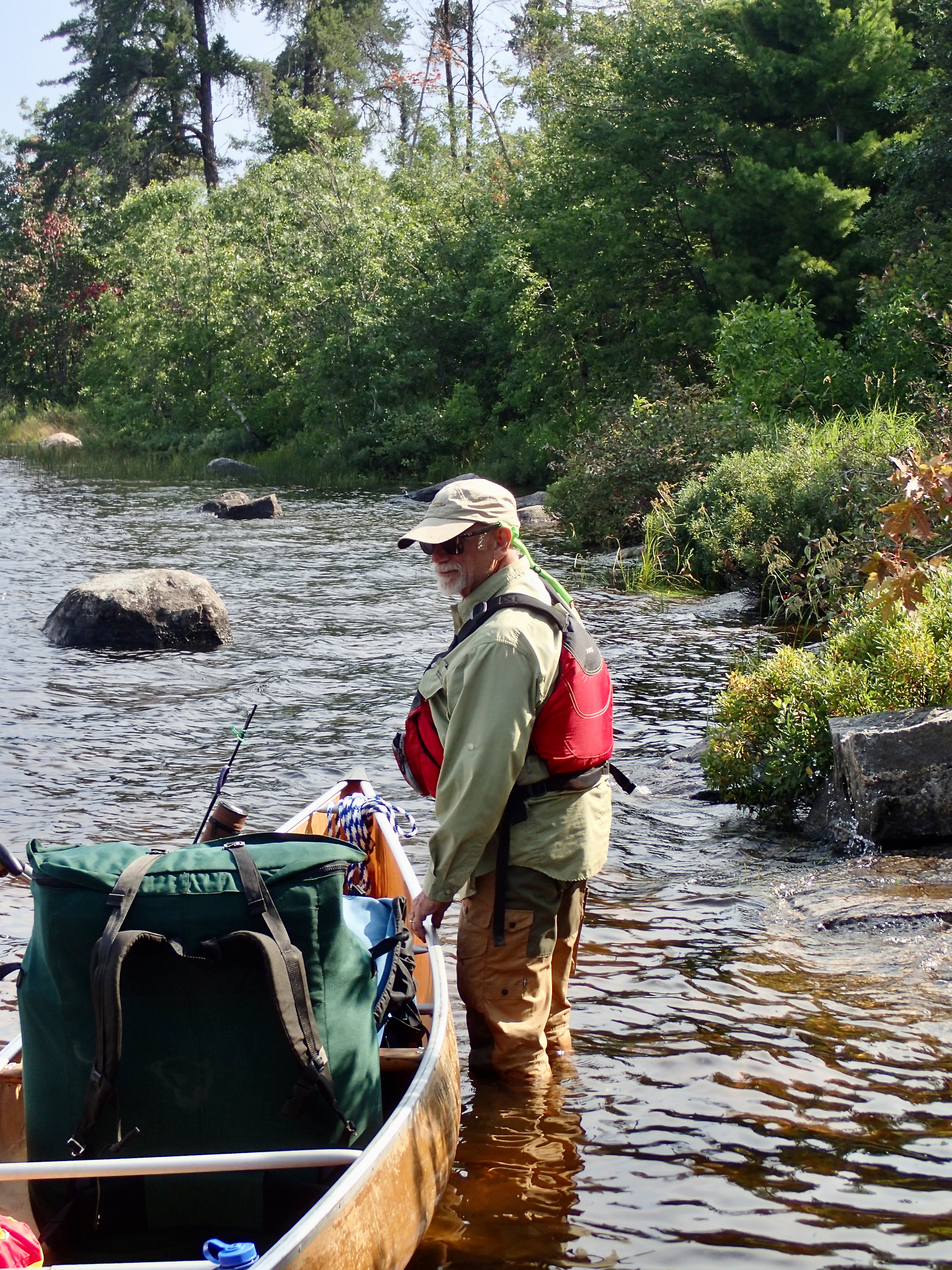 Royce with canoe at Basswood Lake end of Horse Portage 2025-08-08 16:09